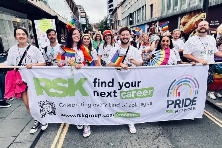Group holding a banner